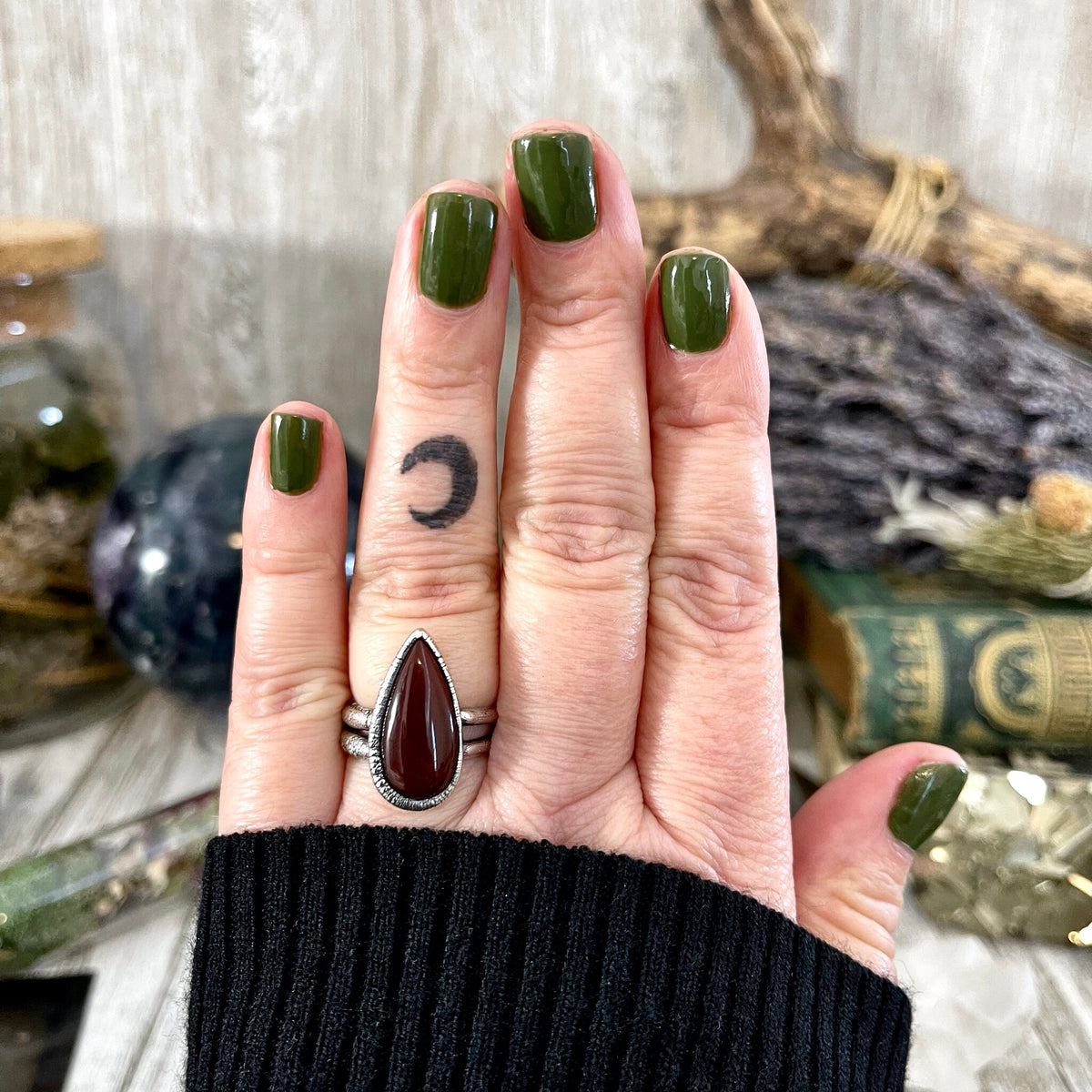 Red carnelian teardrop ring in fine silver by FOXLARK, available in sizes 6 to 11, featuring a sleek teardrop design.