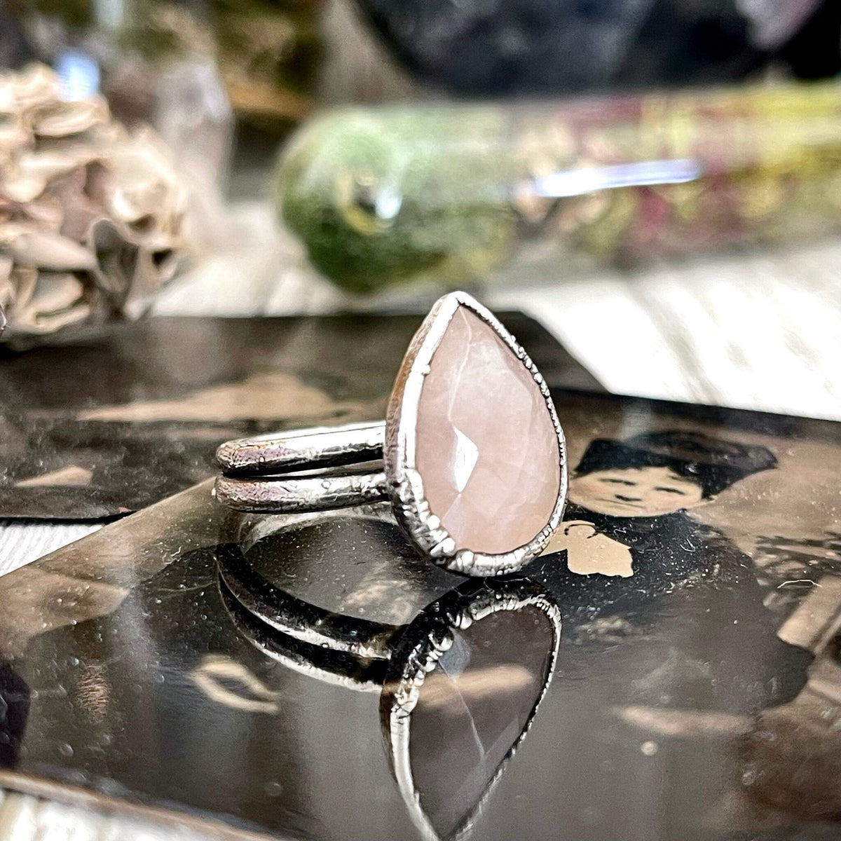 Pink rose quartz silver ring from FOXLARK collection, size 6 to 9, featuring a polished rose quartz gemstone and intricate silver band design.
