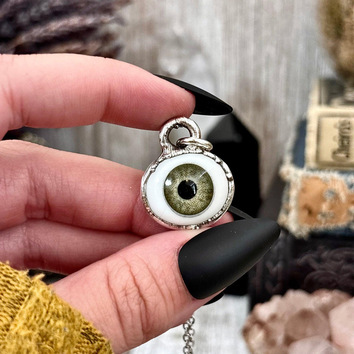 Green iris eye necklace by FOXLARK featuring fine silver, one-of-a-kind design with detailed floral and eye motifs.