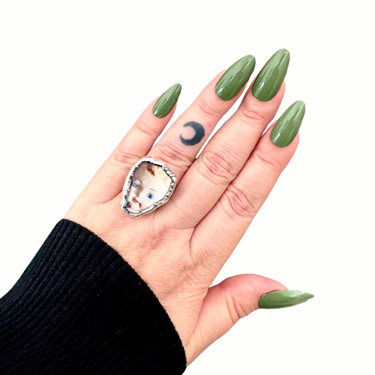 side eye doll head statement ring in fine silver