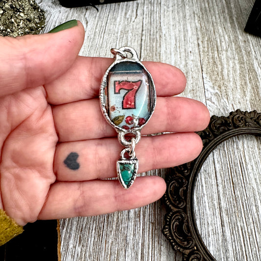 FOXLARK Lucky Number 7 slot machine necklace with turquoise charm in fine silver, featuring detailed design on a delicate chain.