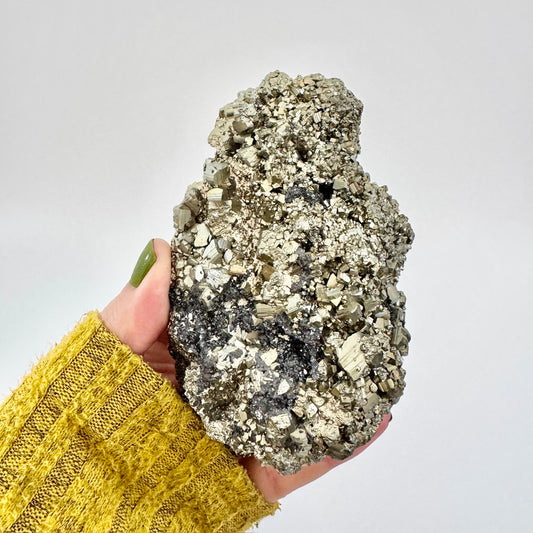 Self-standing pyrite crystal cluster by FoxlarkCrystals showcasing metallic gold mineral formations on a clear base.