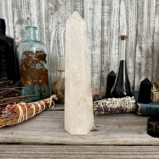 Large clear quartz crystal point standing upright, natural self-standing crystal from FoxlarkCrystals for healing and meditation.