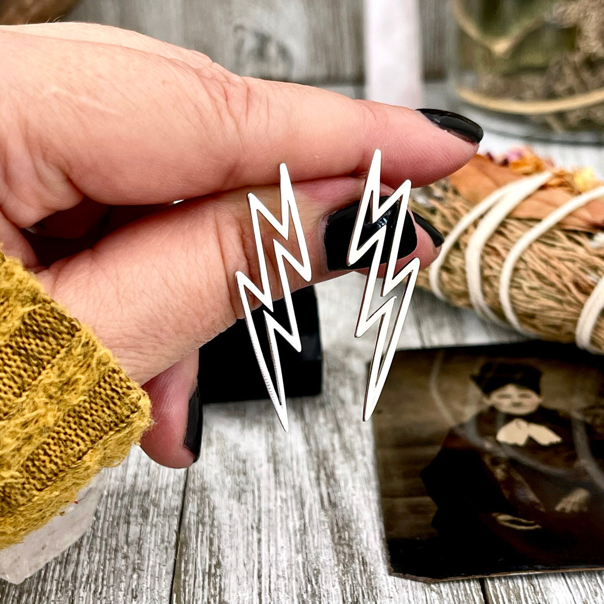 Sterling silver lightning bolt stud earrings by FOXLARK, small and stylish jewelry accessory for pierced ears.